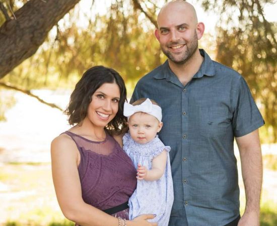 Rachel Sibner with her partner and child. 